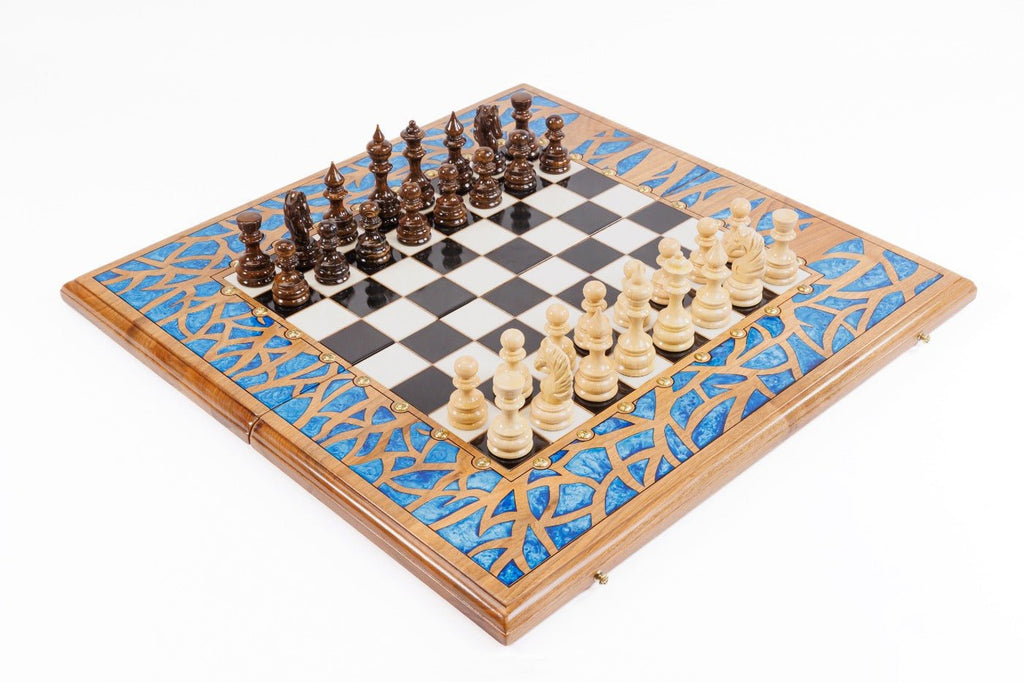Luxury wooden chess set in solid walnut with blue epoxy resin tree branch border — by Hrachya Ohanyan