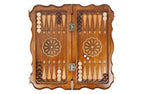 Ornamental backgammon board - playing pieces and dice arranged on the board