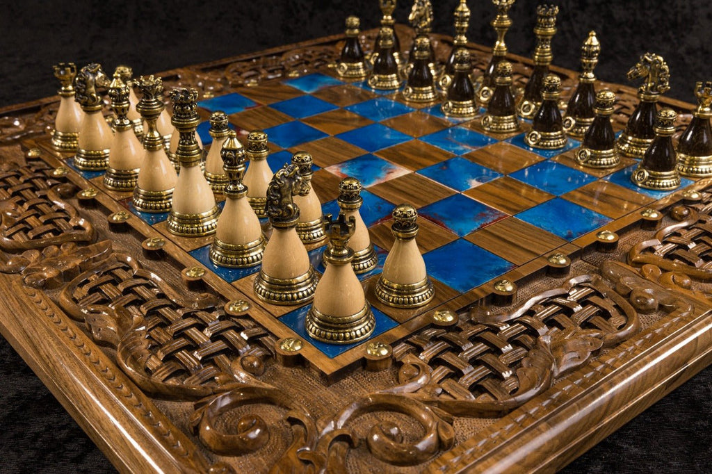 Handcrafted luxury walnut chess board with open lattice braid, acanthus scroll carvings and blue epoxy resin inlays