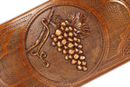 The interior of the open wooden backgammon board highlighting the rich grain and professional-grade playing surface.