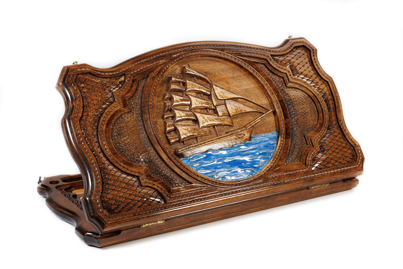 A frontal shot of the closed Sailing Ship backgammon board featuring the carved vessel within the copyrighted contour outline.