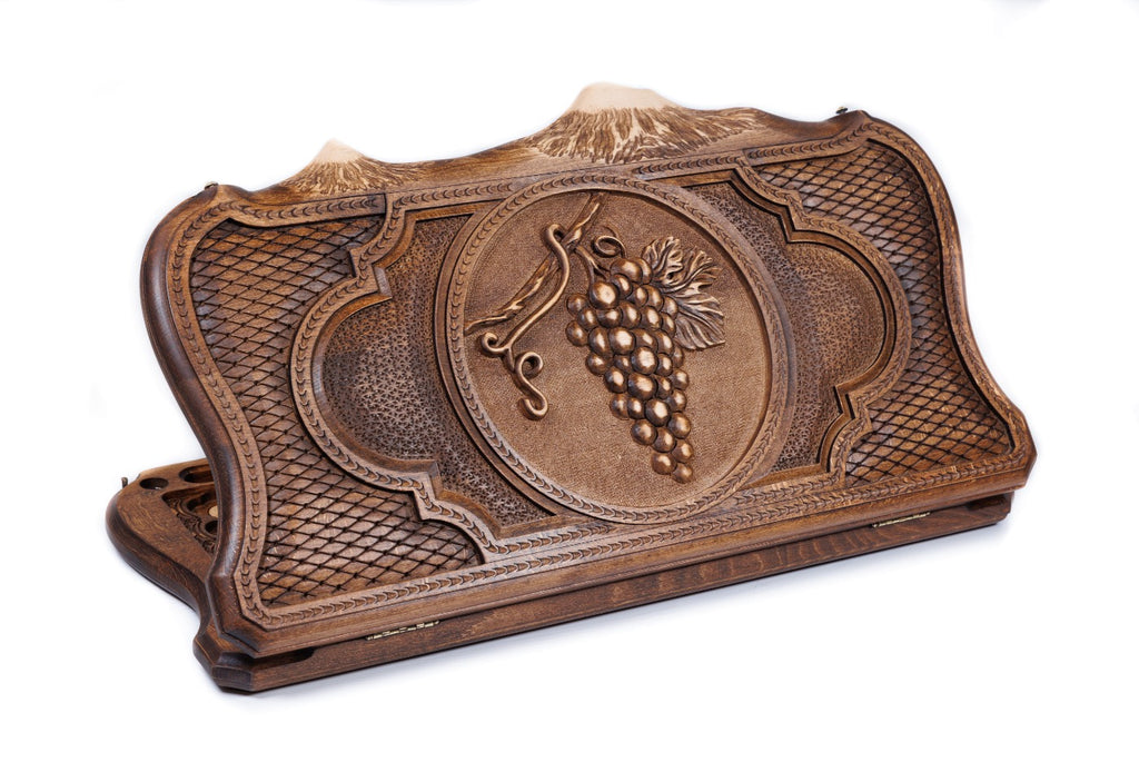 A frontal shot of the closed Grape Cluster backgammon board featuring vine motifs carved inside the copyrighted Mount Ararat outline.