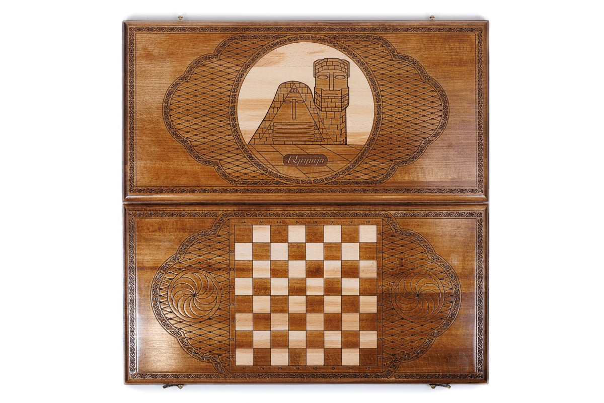 Front cover with the monument above the back cover with the chequerboard, seen from above