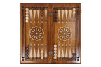 Open Armenian backgammon board 60 cm from above: dark field, pale points, wheel ornament on each half