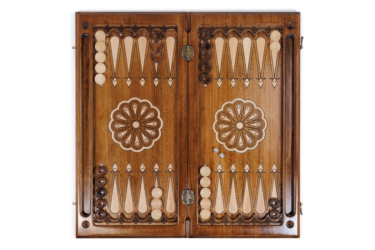 Open Armenian backgammon board 60 cm from above: dark field, pale points, wheel ornament on each half