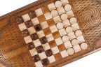 Pale and dark checkers on the chequerboard of the back cover beside an eternity whirl