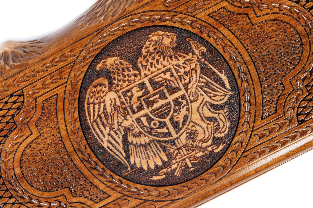 The interior view of the open Hrachya Ohanyan Armenian set highlighting the smooth wood finish and professional playing field.
