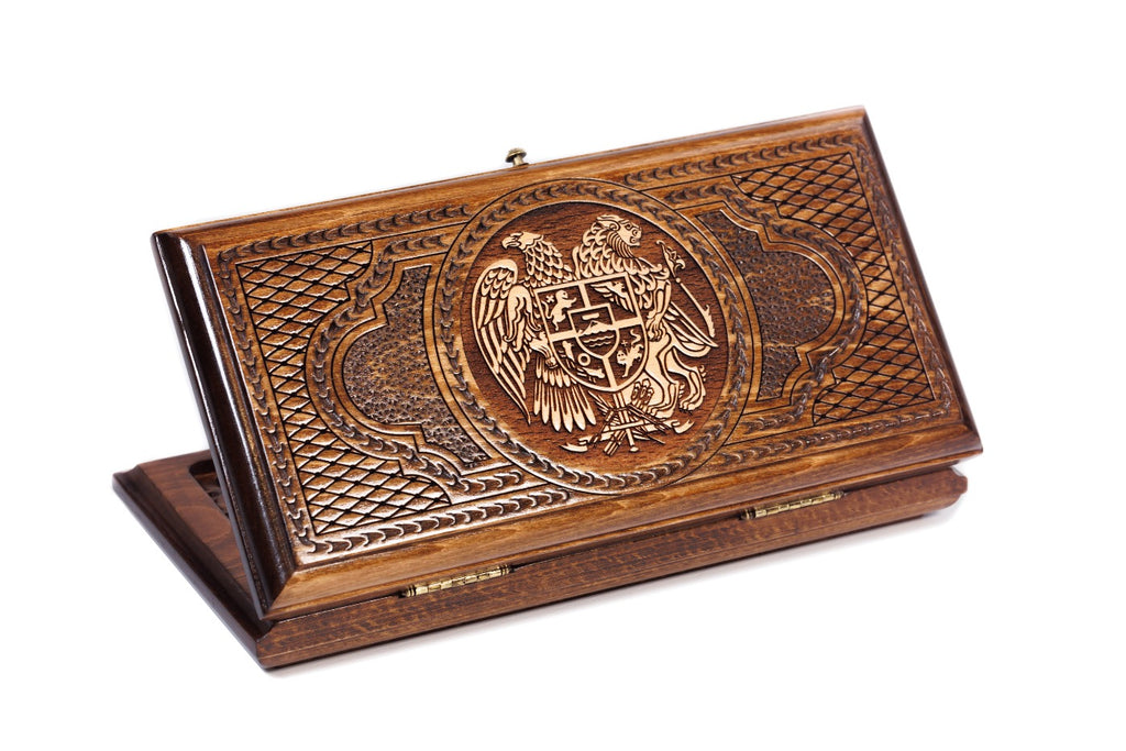 A frontal shot of the closed Armenian Coat of Arms backgammon board showing the detailed high-relief eagle and lion carving.