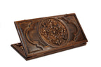 A frontal shot of the closed Ornamental Heritage backgammon board showing the complex, symmetrical hand-carved patterns.