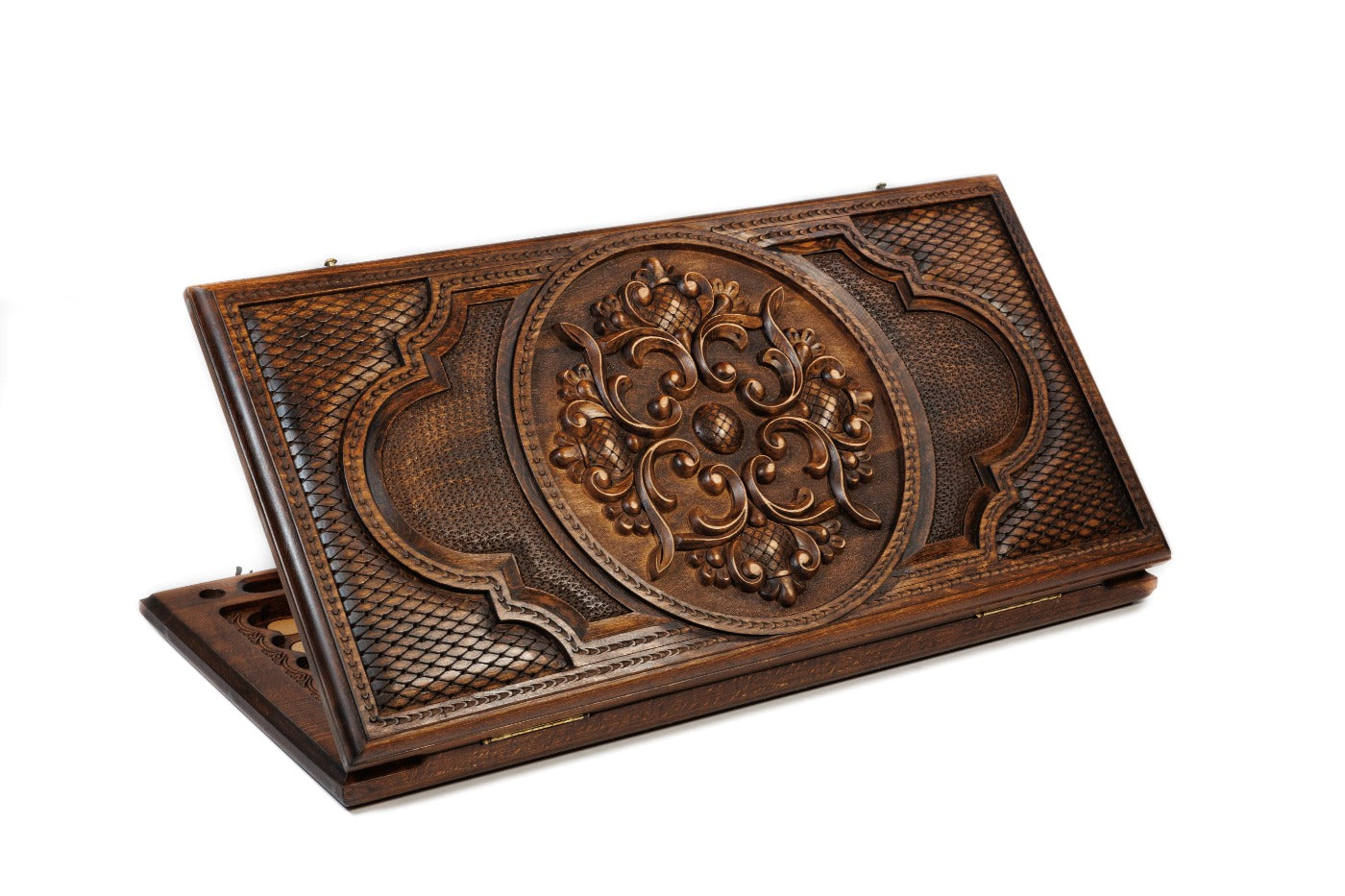 A frontal shot of the closed Ornamental Heritage backgammon board showing the complex, symmetrical hand-carved patterns.