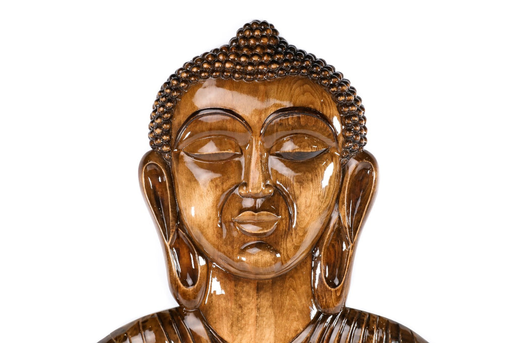 Buddha sculpture in carved wood — side view