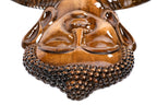 Wooden Buddha sculpture, natural grain detail