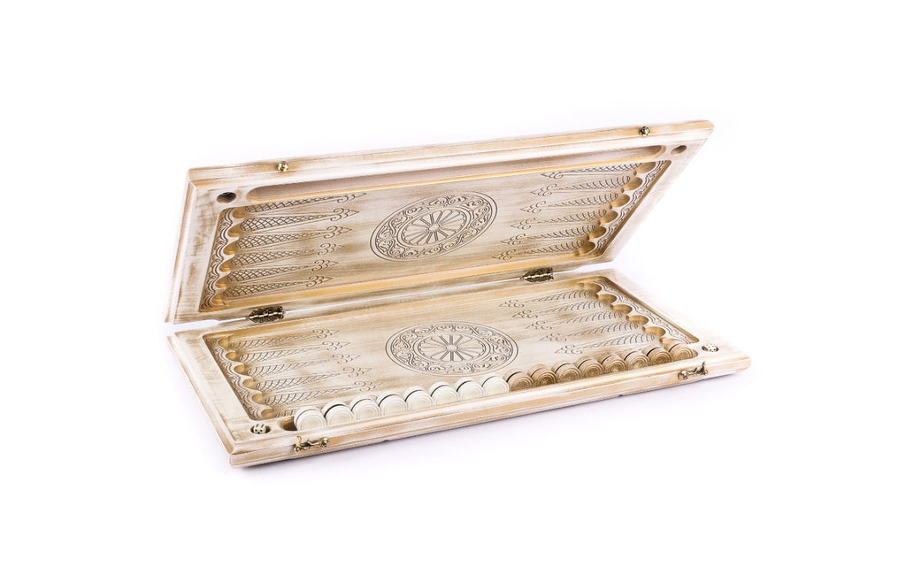 White and gold backgammon board opened flat, points drawn in line and a wheel ornament on each half