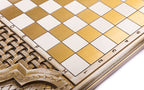 Basket weave carved in relief beside the gold and white squares of the chequerboard, close-up