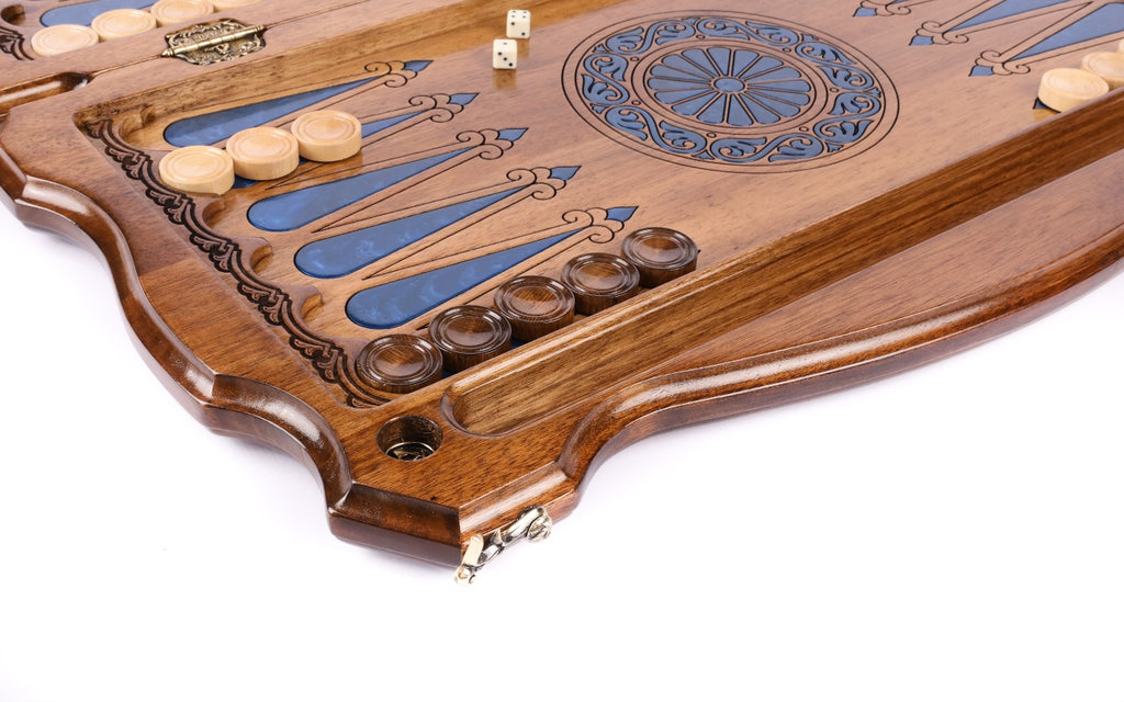 Pale and dark checkers on the blue epoxy points beside the wheel ornament, stamped hinge on the bar