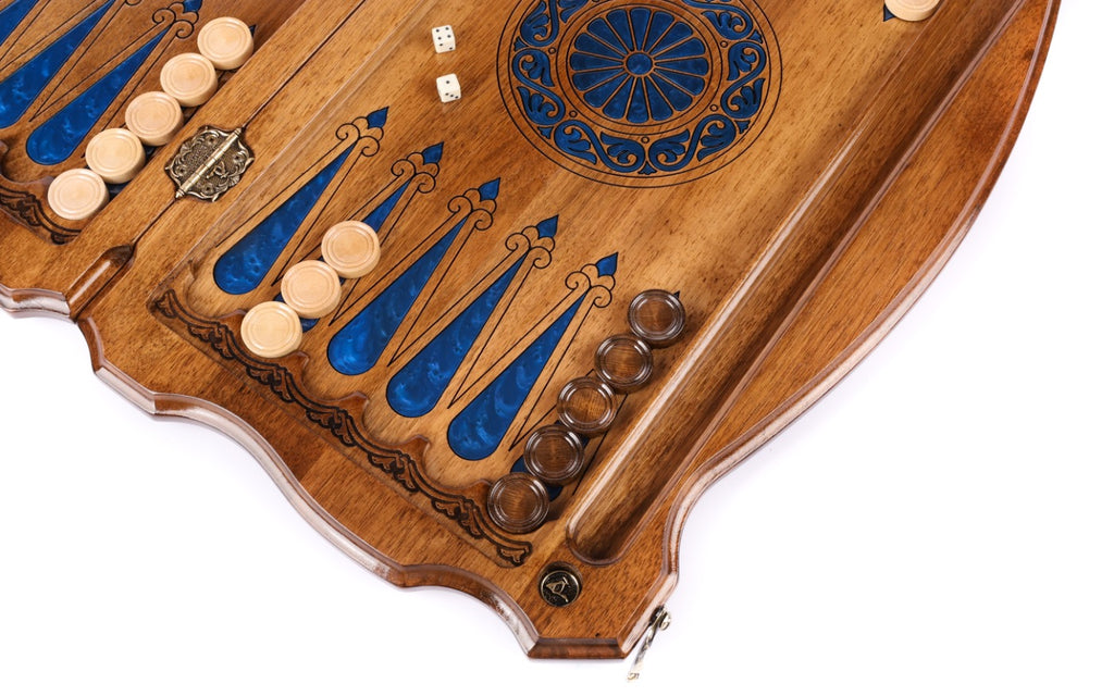 Blue epoxy points and checkers on the open walnut board, dice beside the wheel ornament