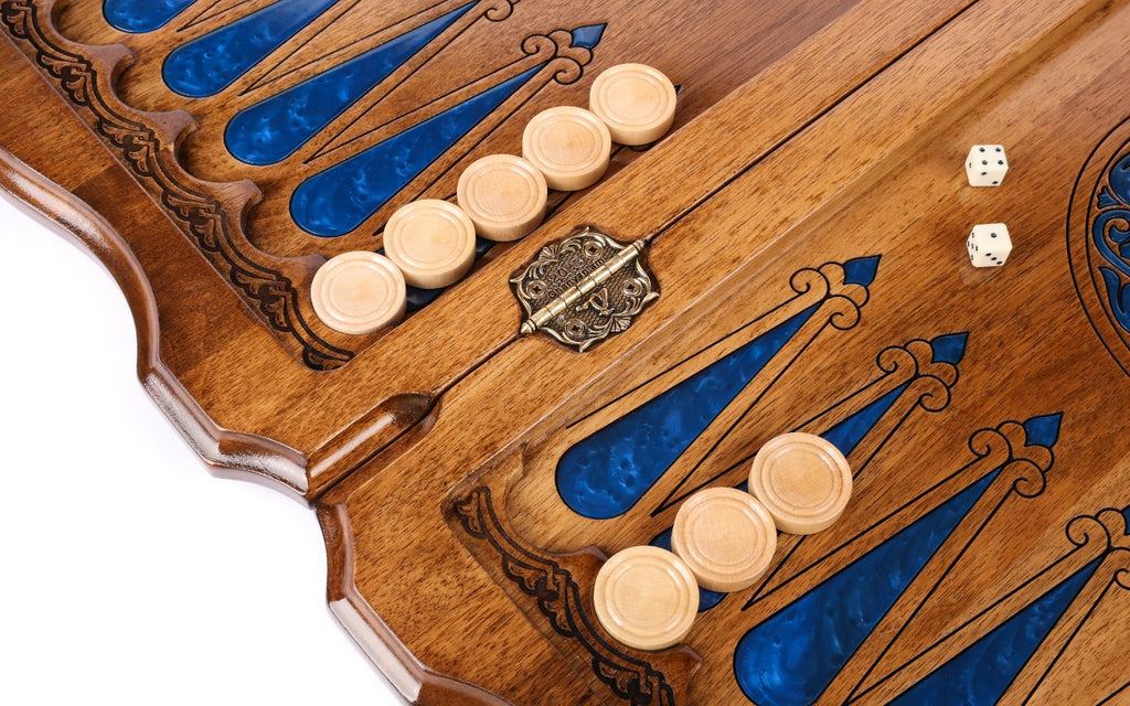 Checkers and dice on the blue epoxy points of the open board, cast-bronze hinge at the bar