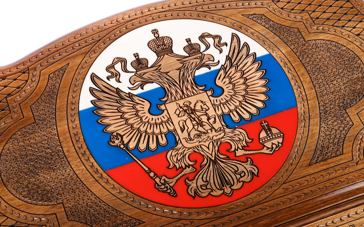 Close-up of the double-headed eagle with three crowns, orb and sceptre carved on the white, blue and red roundel