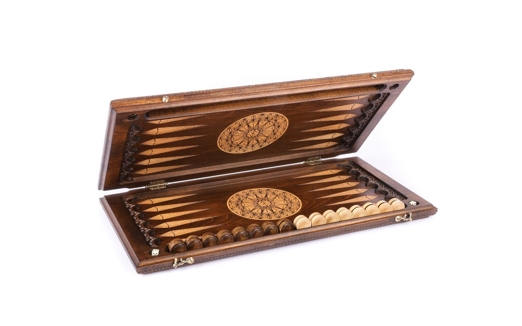 Backgammon board half open, dark field with pale points and star-lattice rosettes on each half