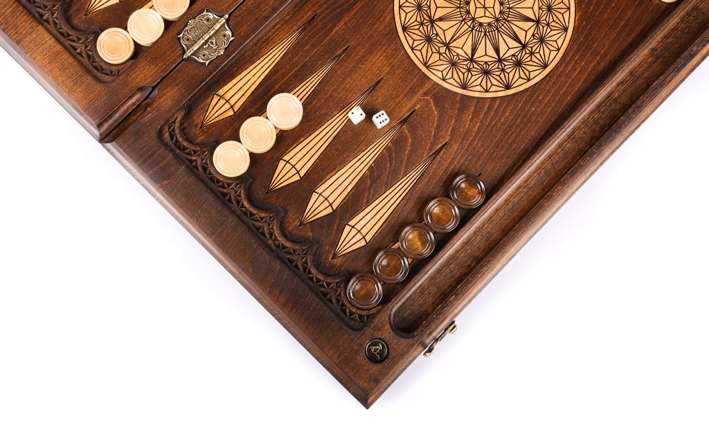 Checkers and dice on the open board beside the star-lattice rosette, hinge on the bar