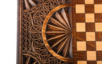 Half of the chequerboard on the back cover with the carved fan and faceted ground beside it