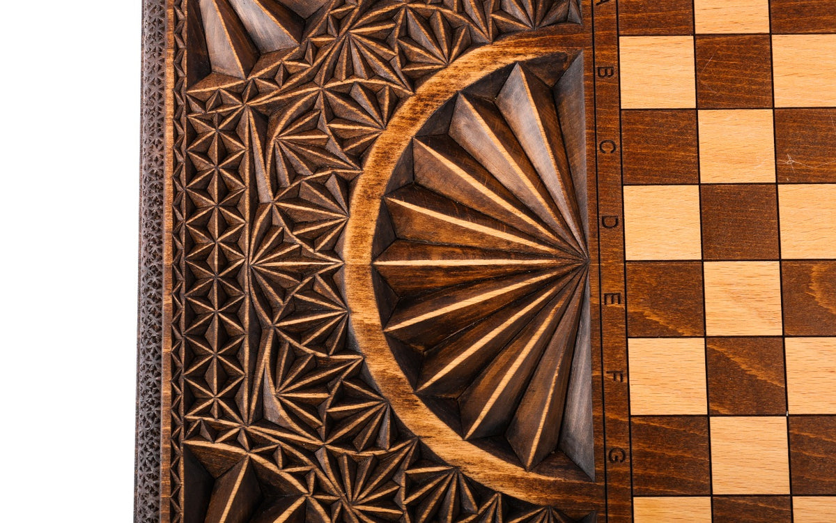 Half of the chequerboard on the back cover with the carved fan and faceted ground beside it