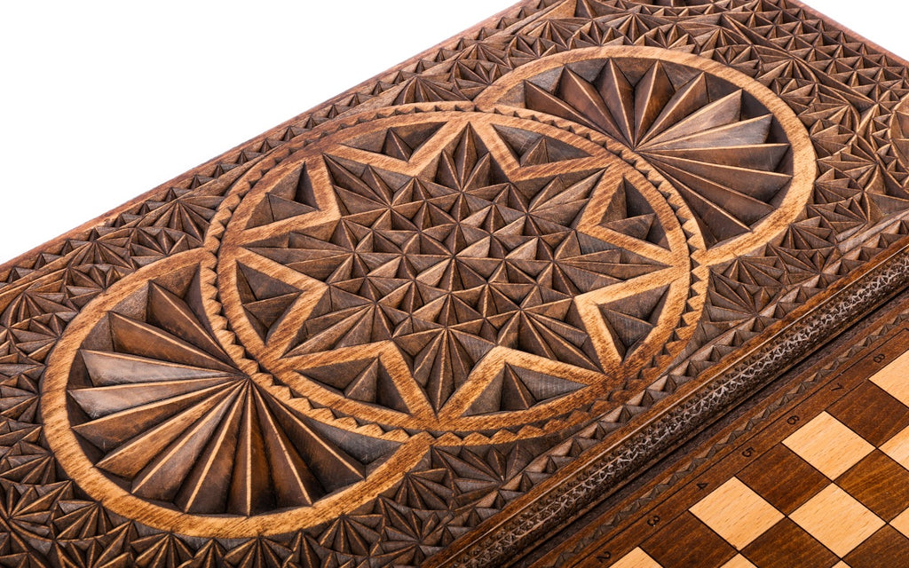 The two overlapping rings and the hollowed eight-pointed star in chip carving, close-up