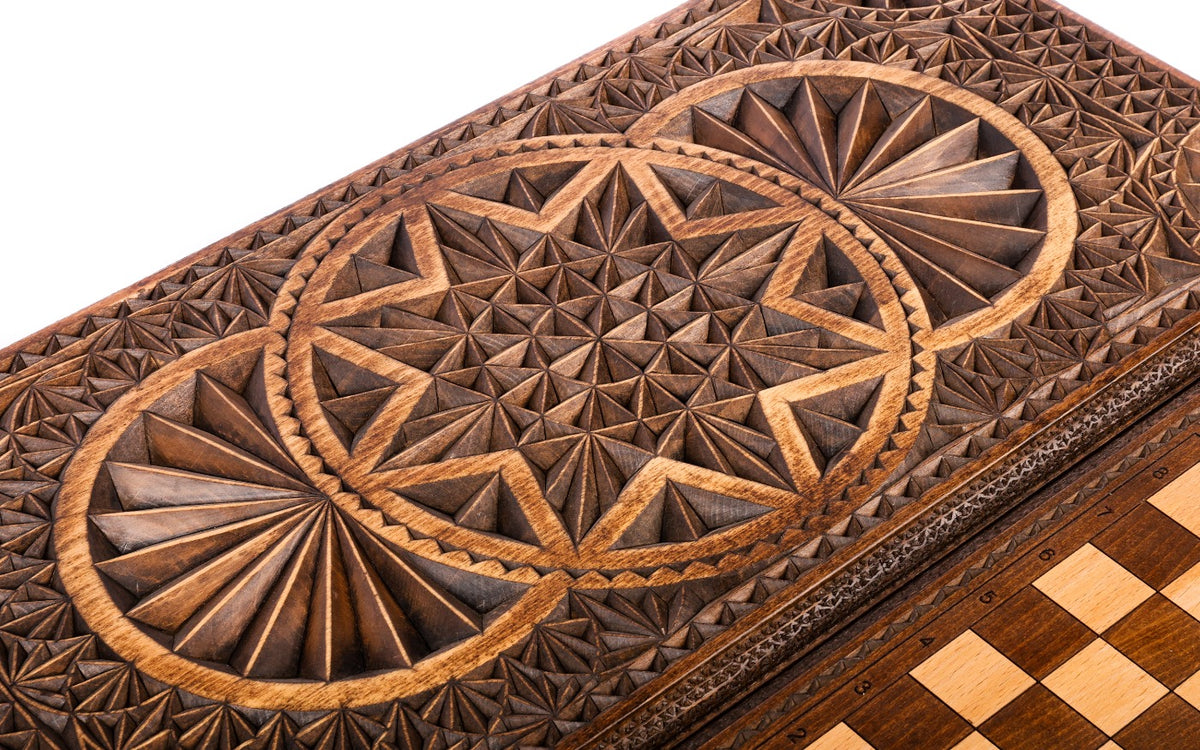 The two overlapping rings and the hollowed eight-pointed star in chip carving, close-up