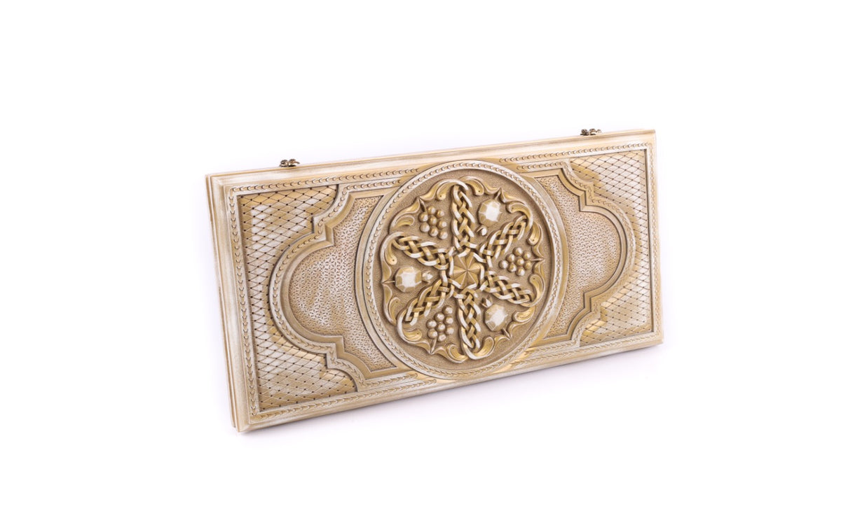 Pomegranate and grapes backgammon set closed, front view of the white lid with aged gold