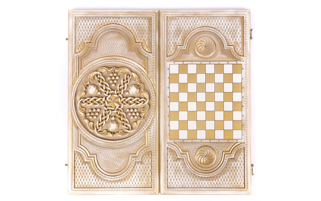 Front cover with the pomegranate panel above the back cover with the gold chequerboard, from above