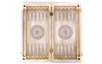 Open white and gold backgammon board 60 cm from above, pale points in line work and wheel ornaments