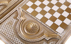Eternity whirl carved in the lobed cartouche beside the chequerboard, close-up
