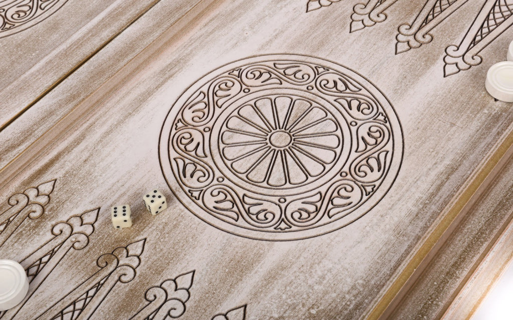 Petal wheel ornament with two dice on the open board, pale points around it