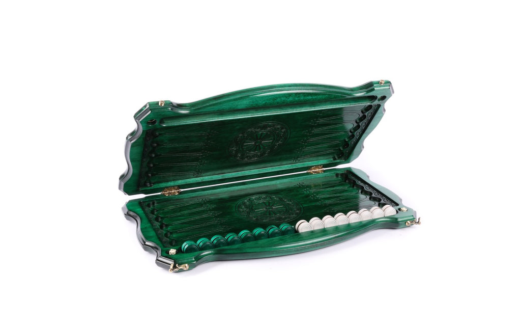 Green backgammon board opened flat, points drawn in line and a wheel ornament on each half
