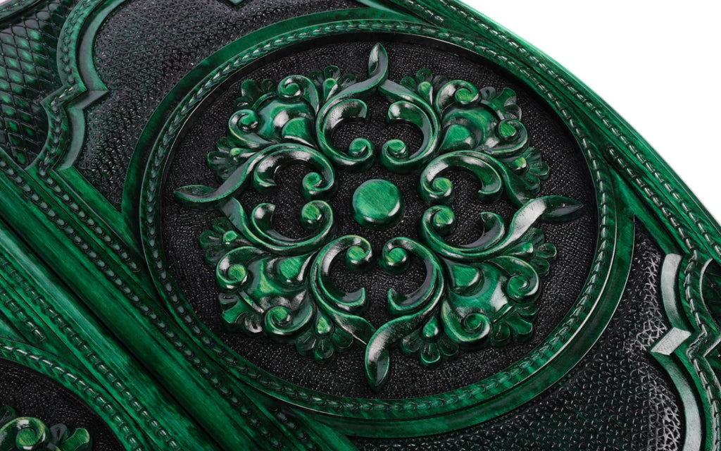 Scroll ornament carved in high relief, green on the ridges and black in the hollows, close-up