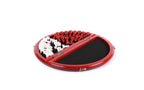 Round red chess board opened to the black velvet-lined compartment with the red and white pieces stored