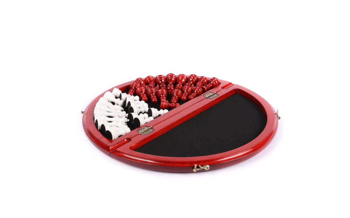 Round red chess board opened to the black velvet-lined compartment with the red and white pieces stored