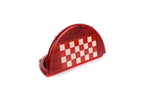 Red and white round chess board folded and standing on edge, carved rim visible