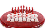 Front view of the round red and white chess set with pieces in position