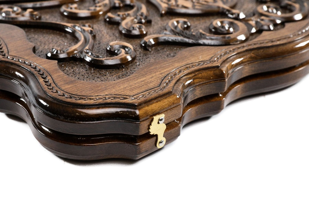 Edge of the closed contour board with the bead-moulded rim and brass clasp