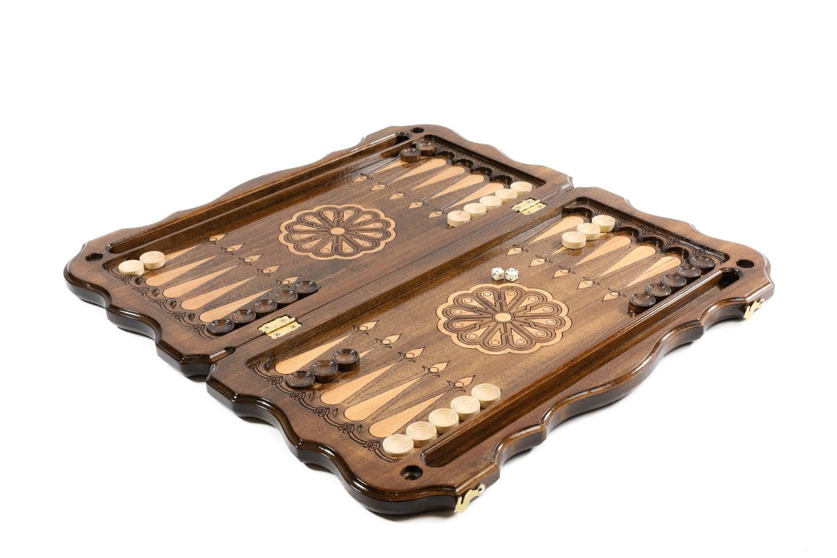 Backgammon set open with pale and dark checkers and dice on the 60 cm board, angled view