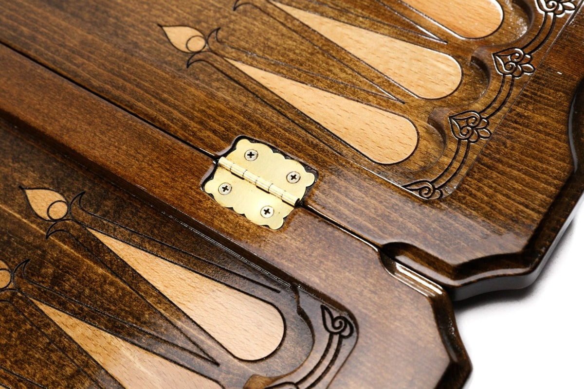 Brass hinge on the centre bar of the open board with pale and dark points either side