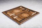 Backgammon set open with pale and dark checkers set up and a twelve-petal wheel on each half