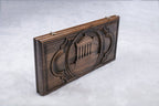 Closed backgammon board on edge, Garni Temple columns and steps carved in a round frame with a rope border