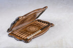 Armenian backgammon set opening, carved points, a wheel ornament and checkers in the side trays