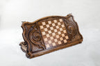 Back of the stag backgammon board, inlaid squares between two carved eternity whirls