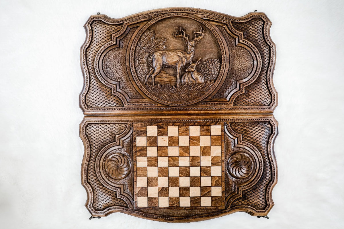 Both outer faces of the board from above: the stag and doe lid and the back with inlaid squares