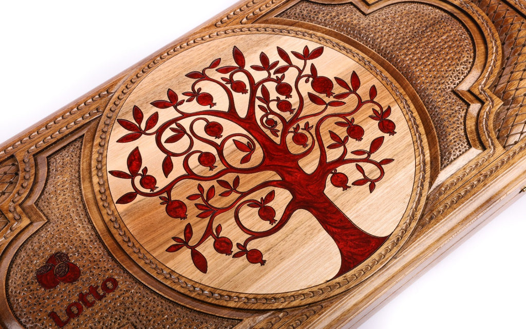 Carved tree of life with red pomegranates on the walnut lotto lid