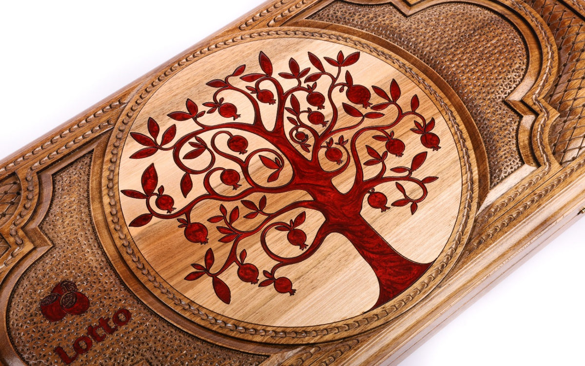 Carved tree of life with red pomegranates on the walnut lotto lid