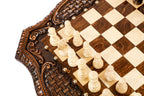 Side profile of the ornately carved chess table
